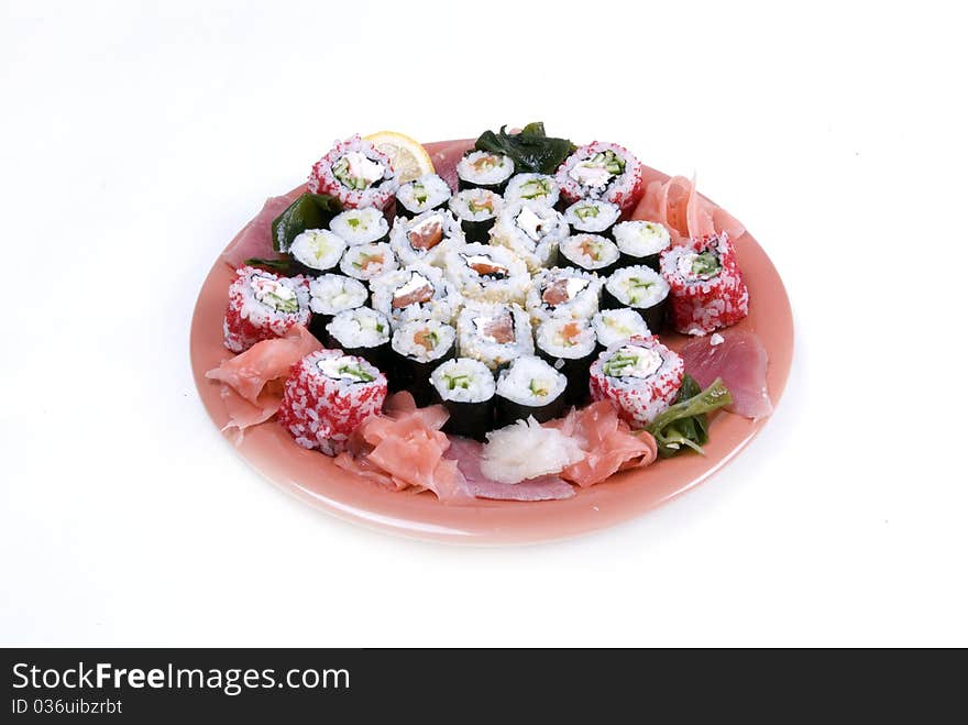 Collection of different rolls served on the round plate. Collection of different rolls served on the round plate