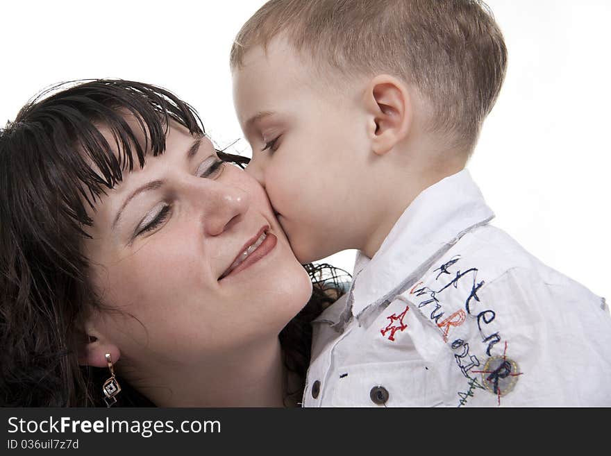 Happy mother embraces the son on a white background. Happy mother embraces the son on a white background