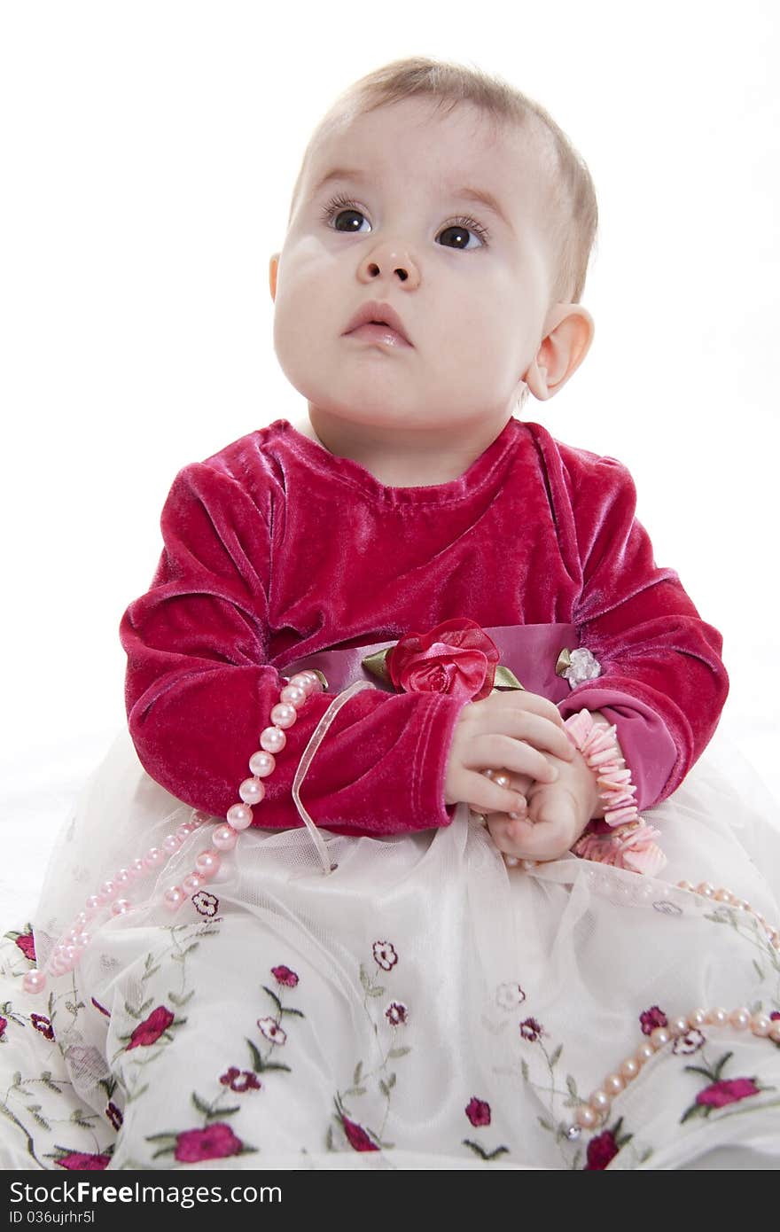 Portrait of sitting little girl isolated on white. Portrait of sitting little girl isolated on white.