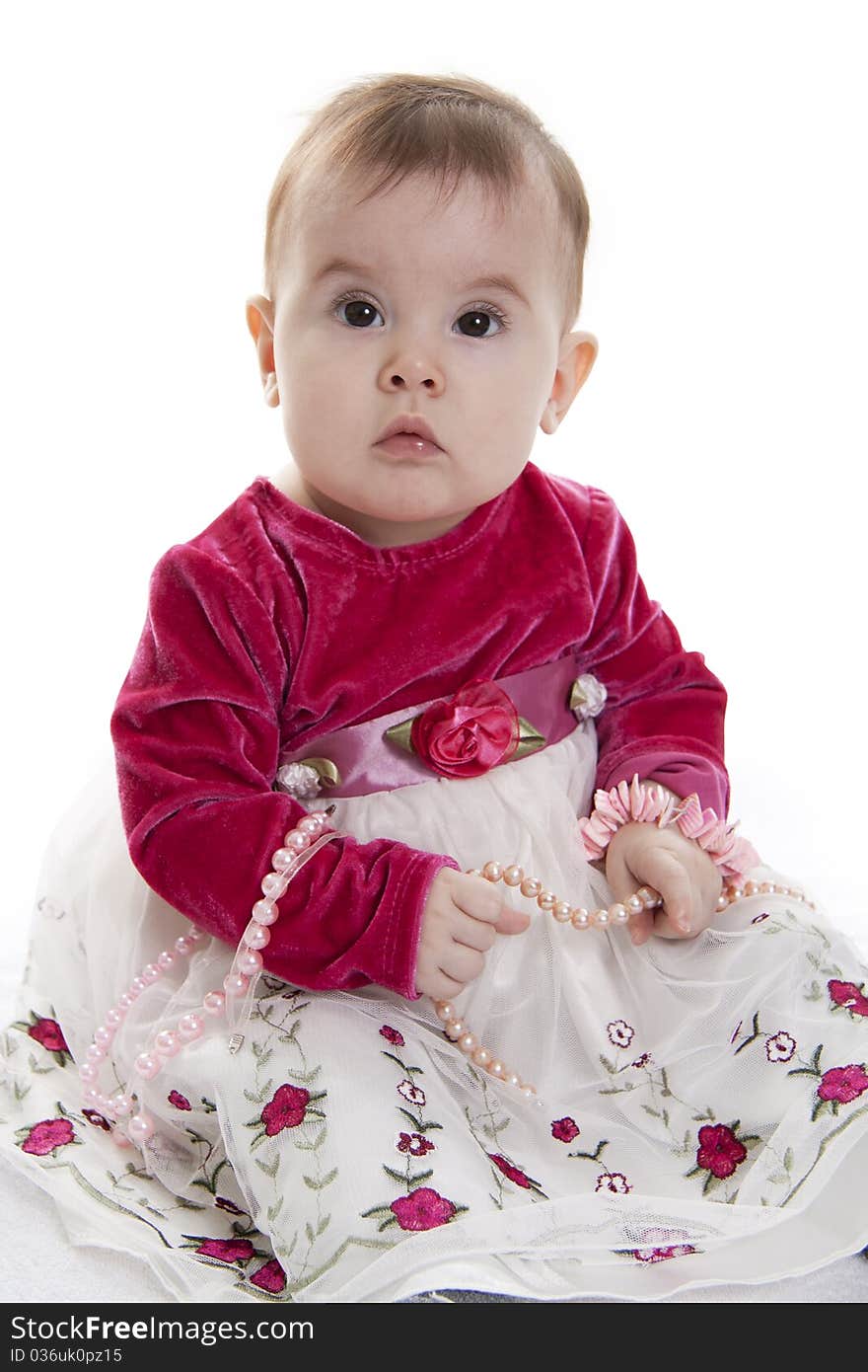 Portrait of sitting little girl isolated on white. Portrait of sitting little girl isolated on white.