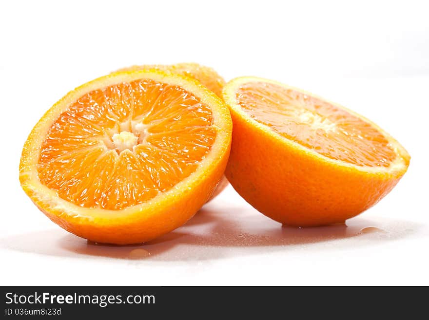 Oranges isolated on white background cut in two