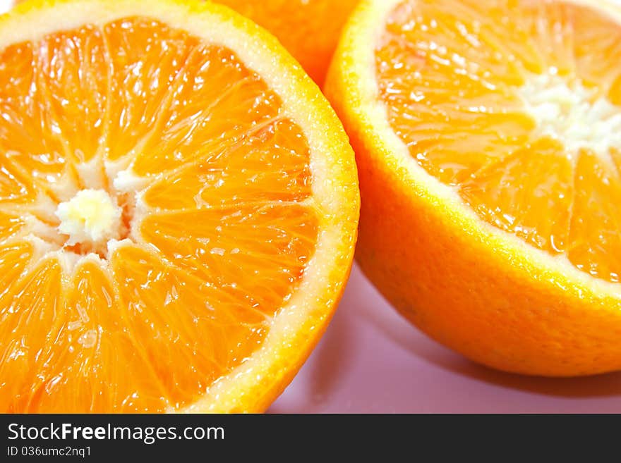 Oranges isolated on white background cut in two