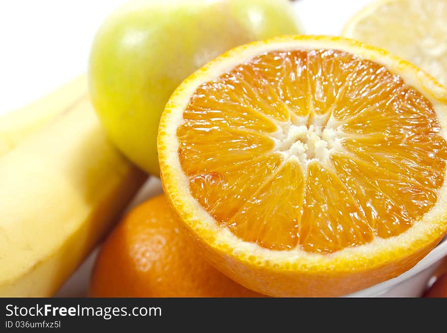 Different fruits on white background, shot close.