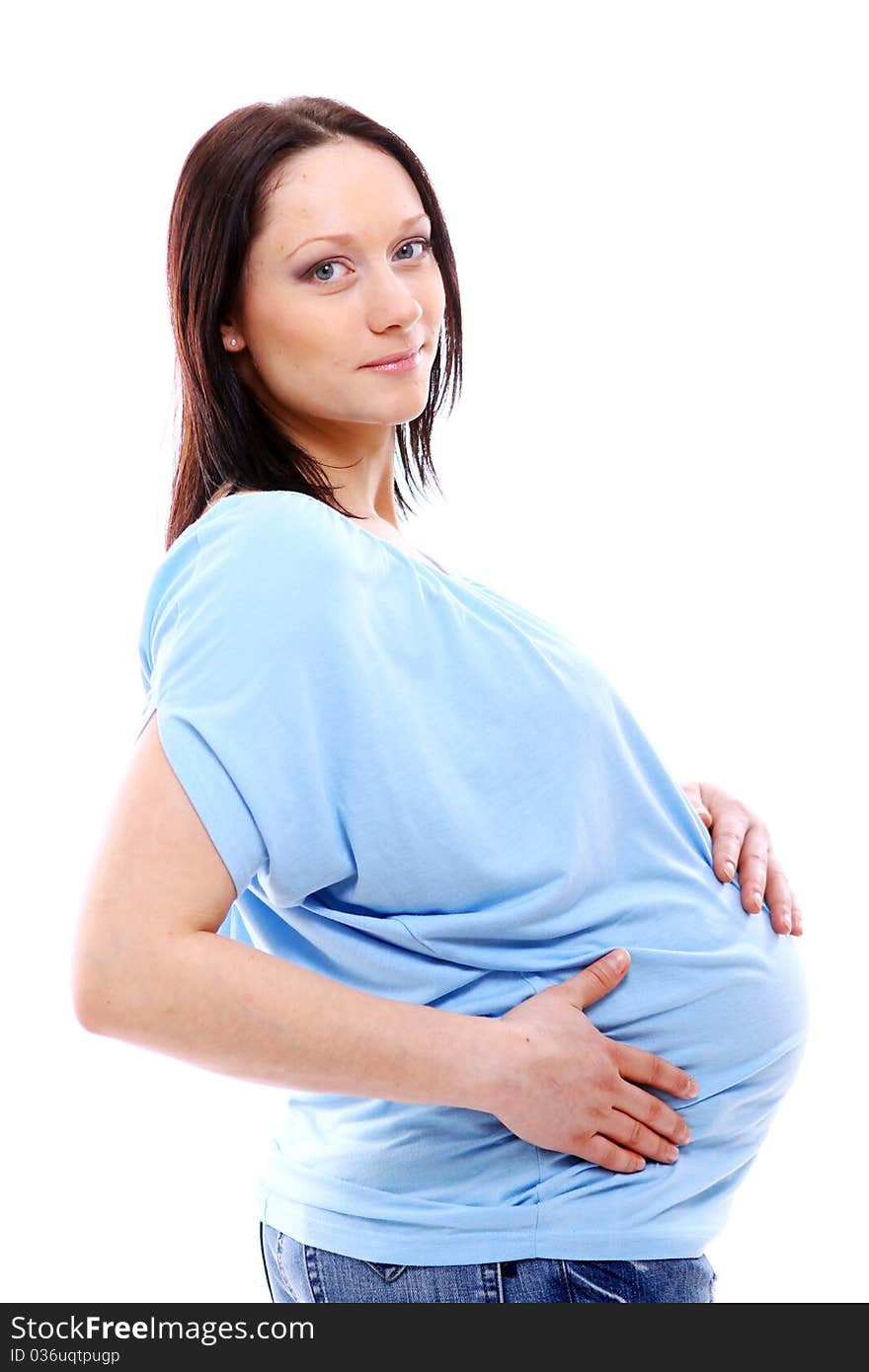 Young and beautiful pregnant woman isolated on white background