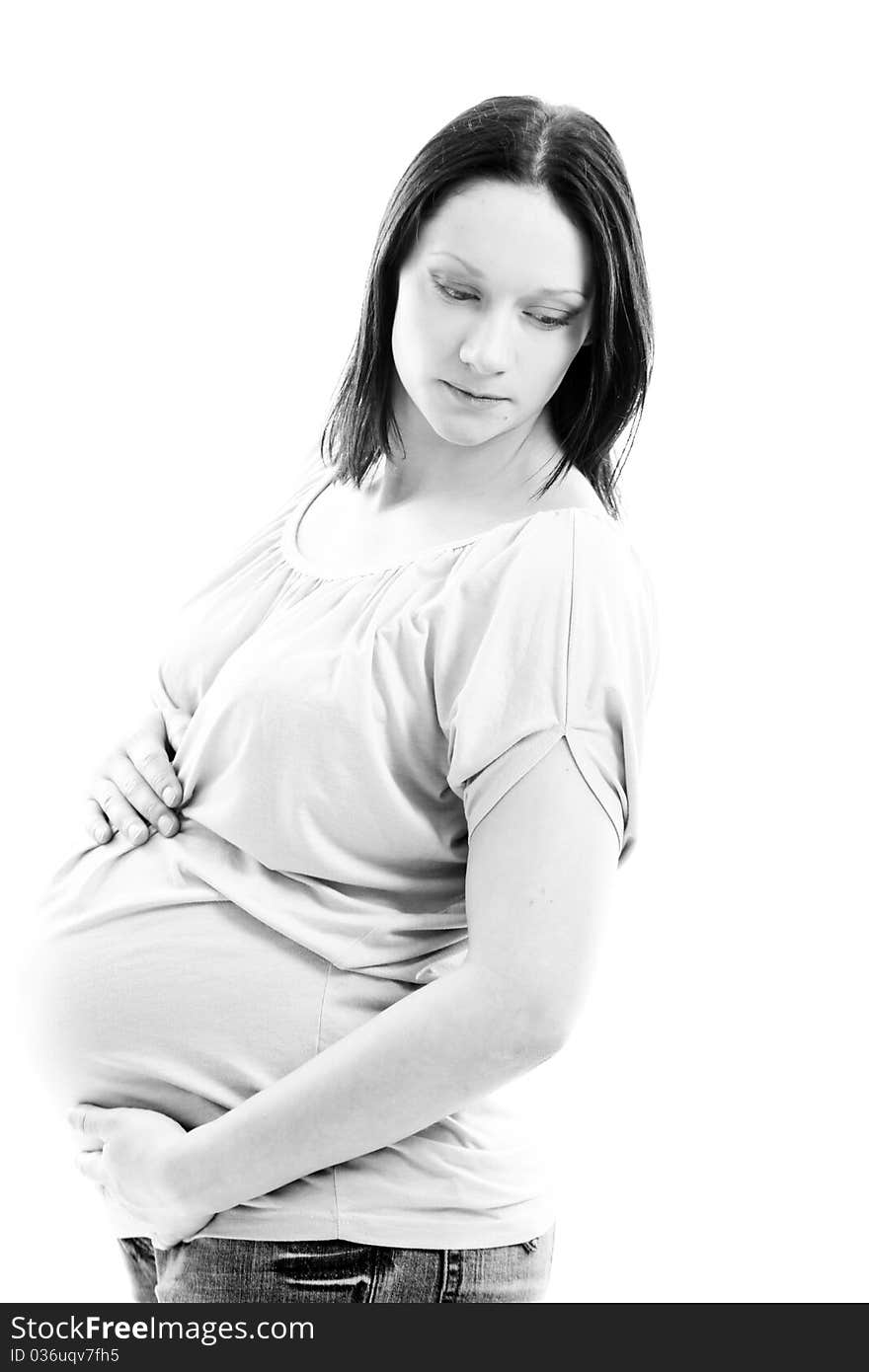 Young and beautiful pregnant woman isolated on white background