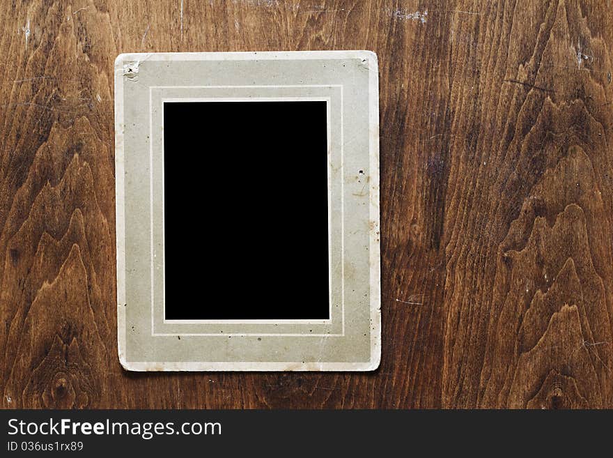 Antique photo frame on wooden background. Antique photo frame on wooden background