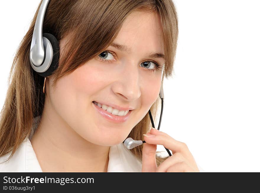 Young female customer service representative in headset, smiling  on a white background