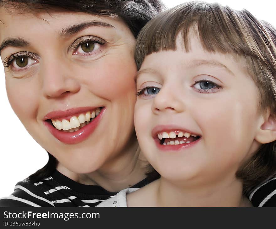 Mother and daughter looking on something and smiling