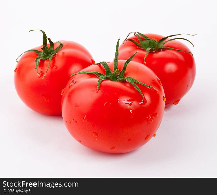 Red tomatoes vegetable with cut isolated on white background