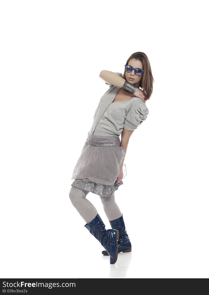 Young woman in cool clothes posing against white background. Young woman in cool clothes posing against white background