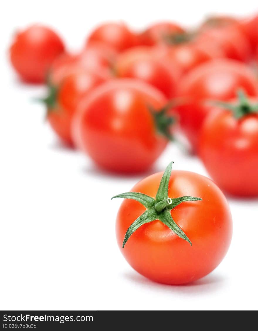 Beautiful ripe cherry tomatoes isolated on white background. Beautiful ripe cherry tomatoes isolated on white background