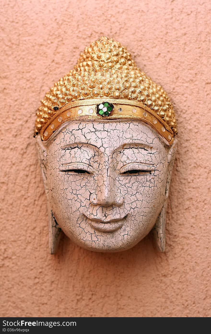 Handcrafted wooden buddha face