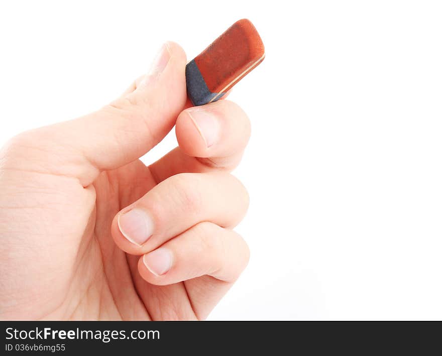 Hand holding eraser. Isolated on white background