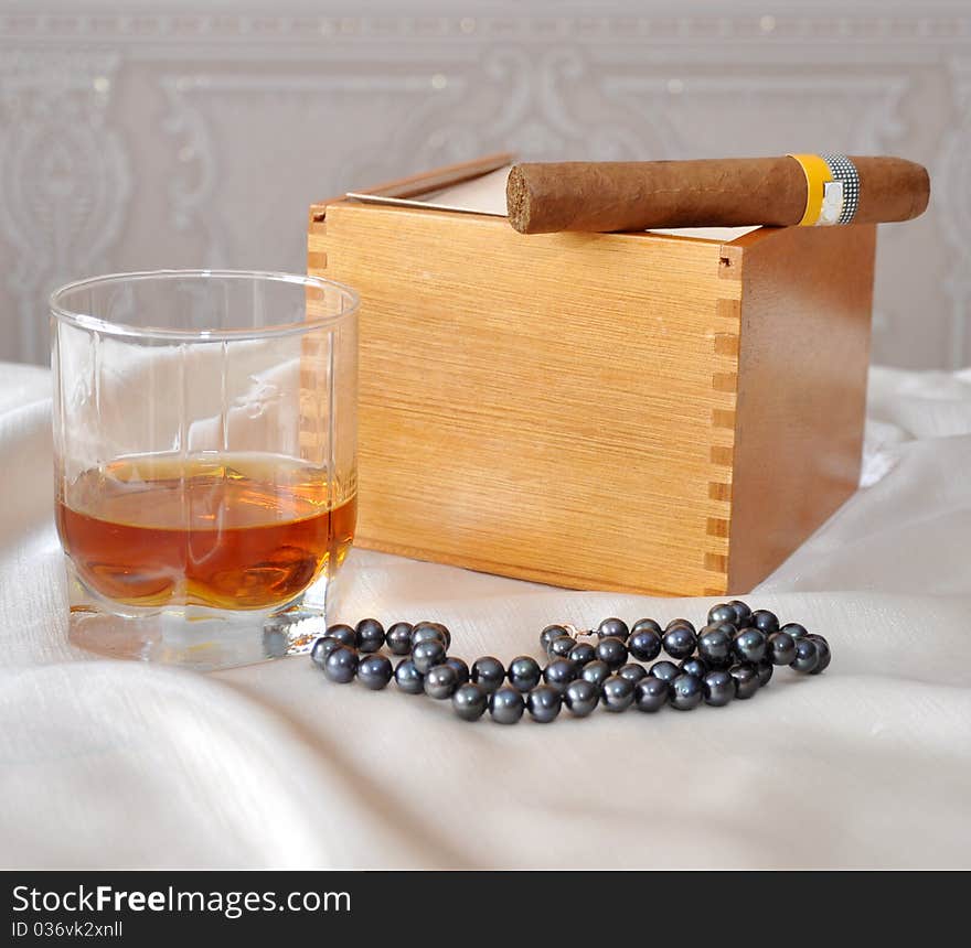 Cigars, cognac and pearls