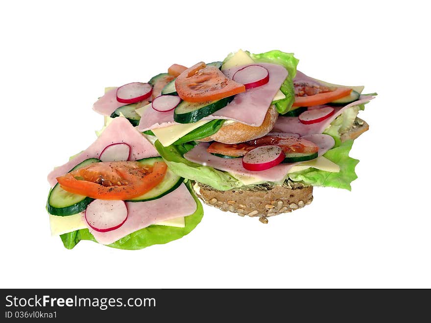 Appetizing sandwich from ham lettuce and tomato on white background