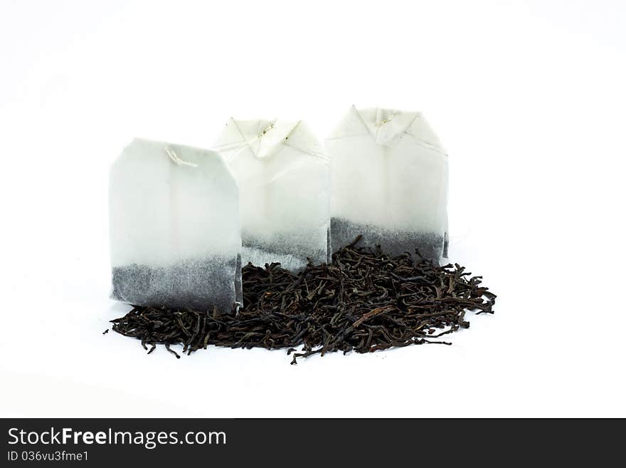 Tea bags and dried tea leaves