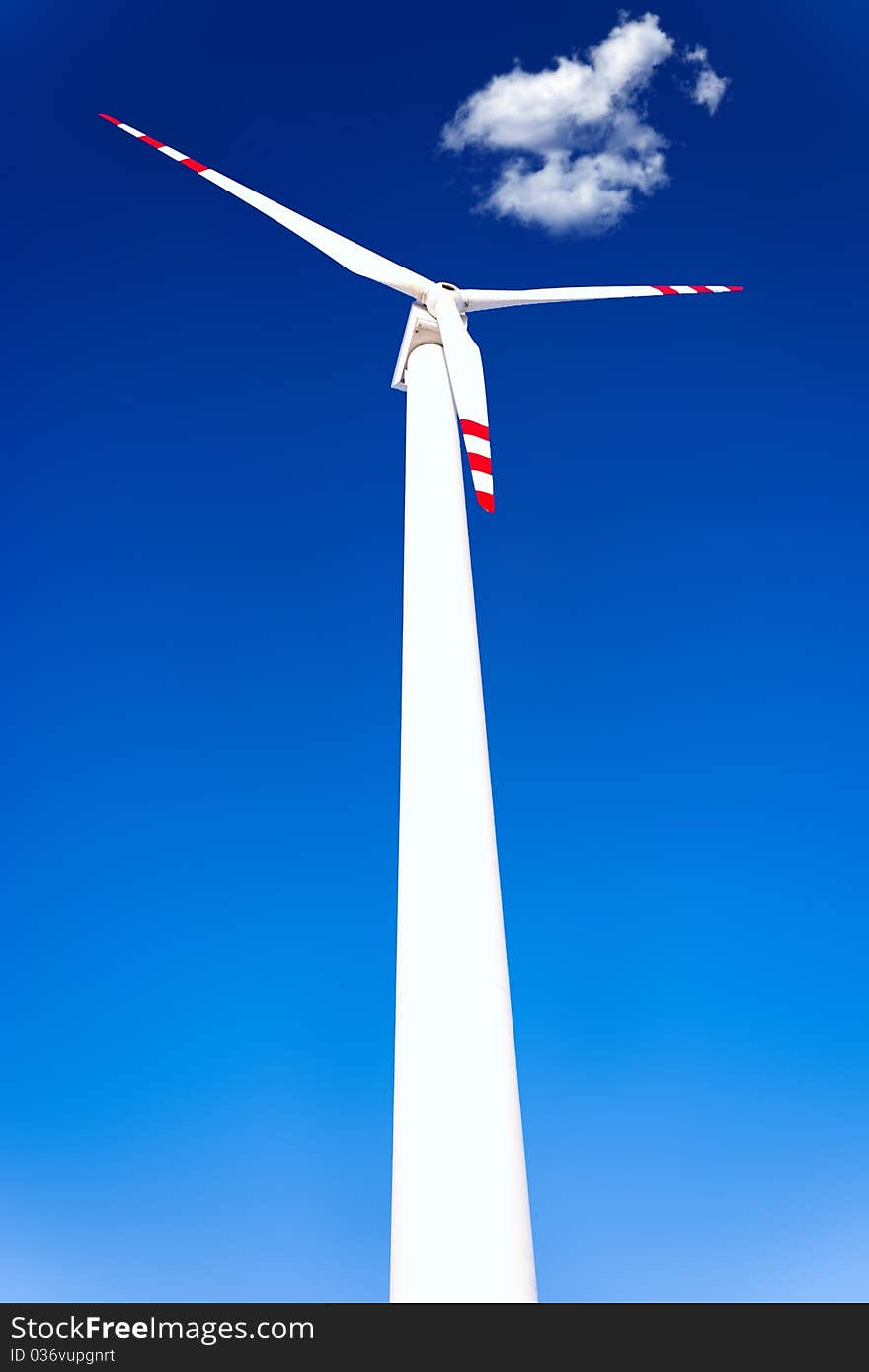 Wind turbines on green field. Alternative source of energy. Wind turbines on green field. Alternative source of energy