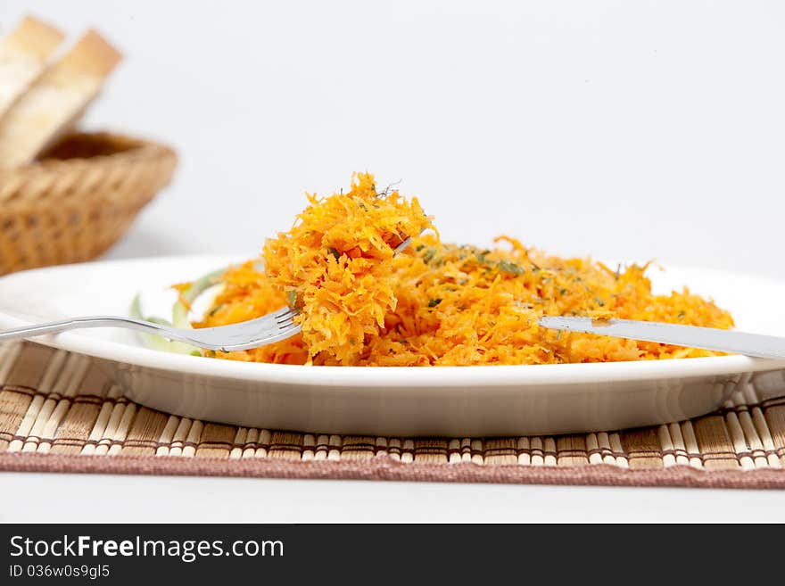 Salad from carrots on a plate. Salad from carrots on a plate