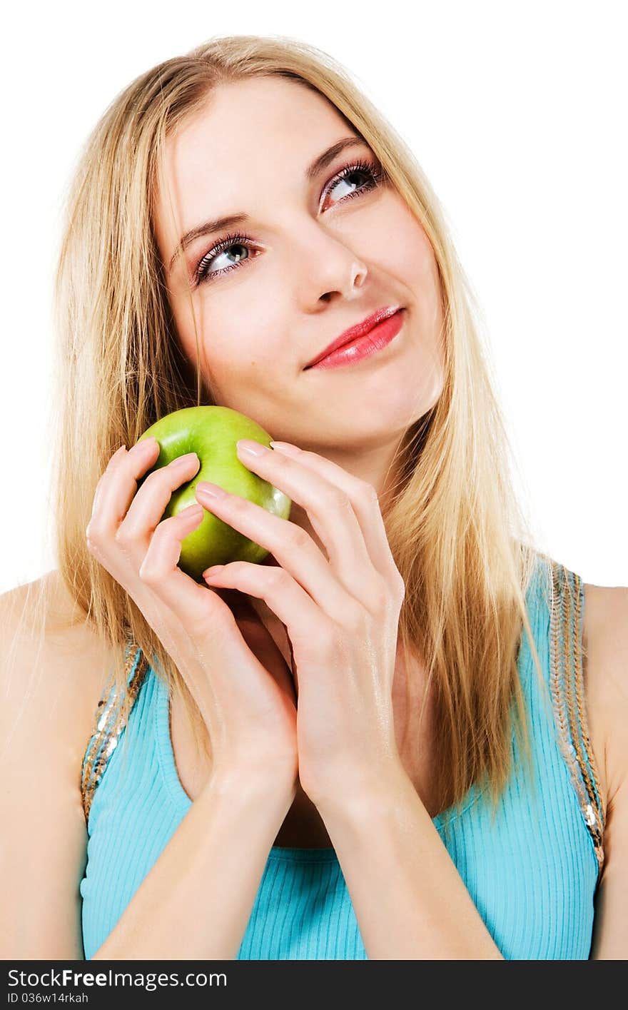 Young beautiful woman with green apple against white background. Young beautiful woman with green apple against white background