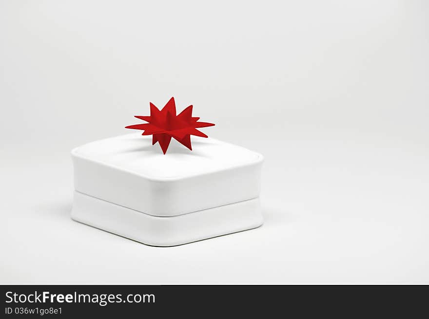 Close-up image of leather gift box on bright background.