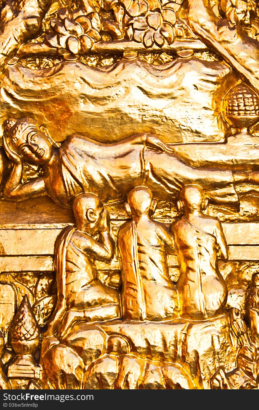 Engraving door is buddhist history image and paint gold color. Engraving door is buddhist history image and paint gold color