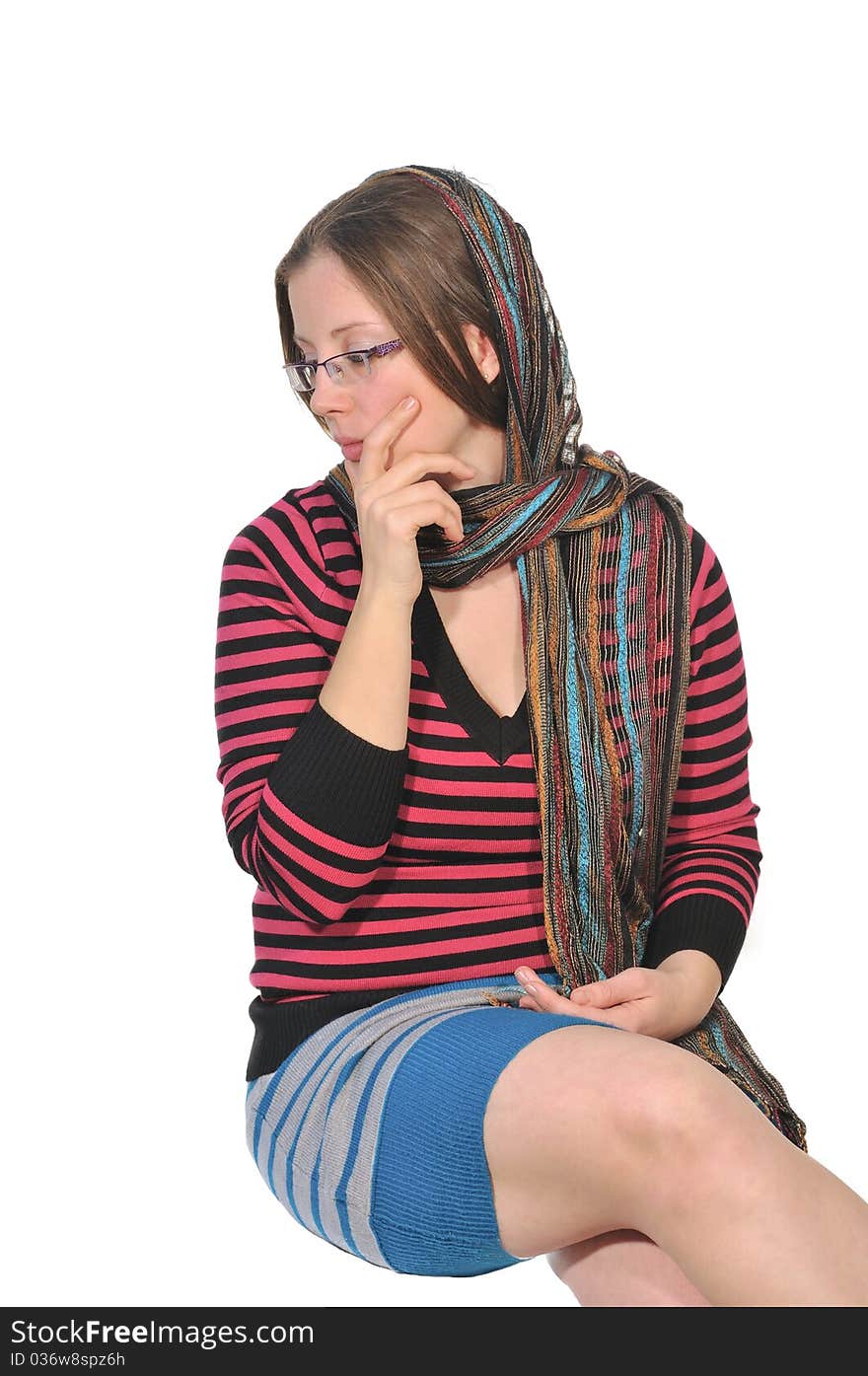 Portrait of a girl in a striped blouse with a beautiful shawl on her head. Portrait of a girl in a striped blouse with a beautiful shawl on her head