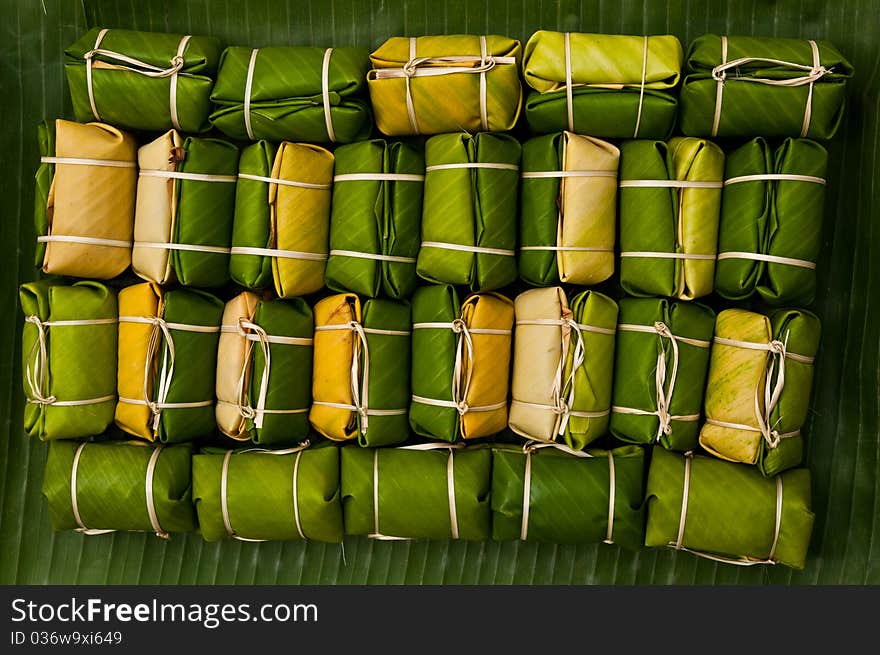 Thai style dessert,made from banana and glutionous rice wrap with banana leaf