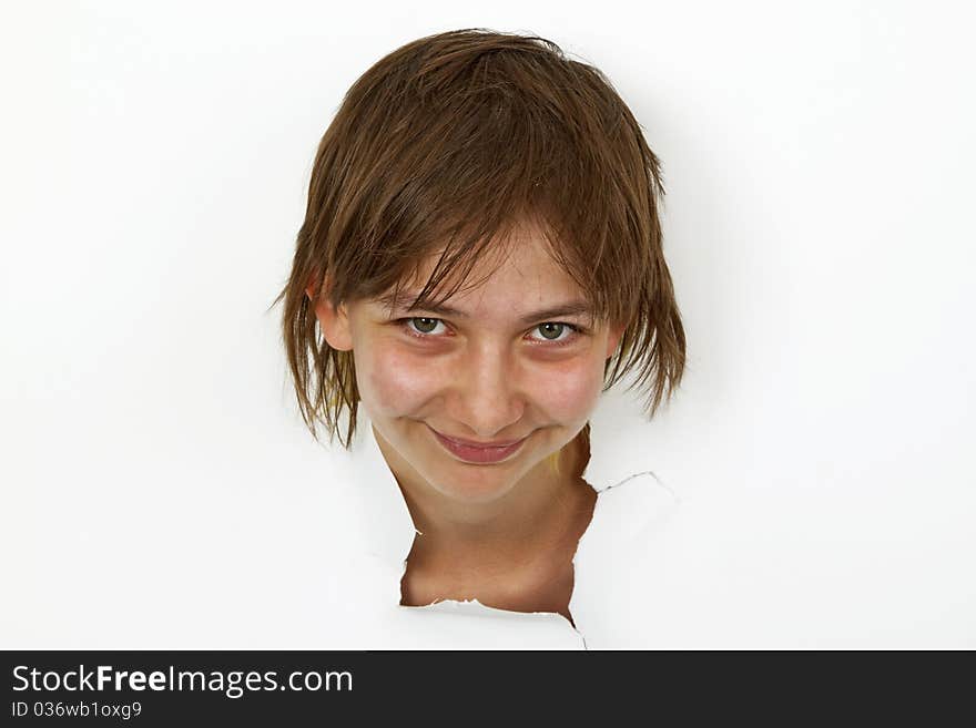 Young Woman is looking out of cutted paper.