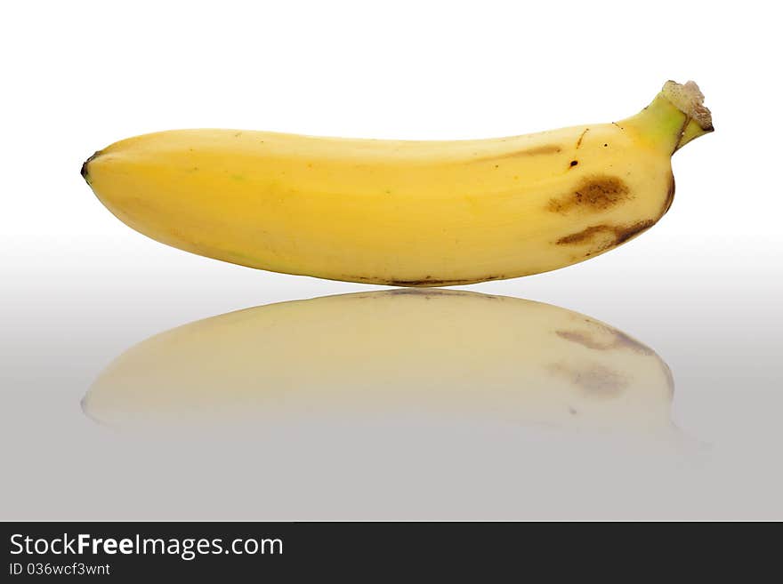 Closeup of single ripe banana isolated on white background.