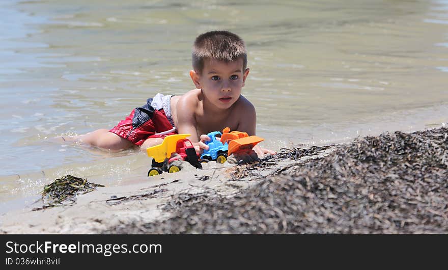 A boy playing at the beach. A boy playing at the beach