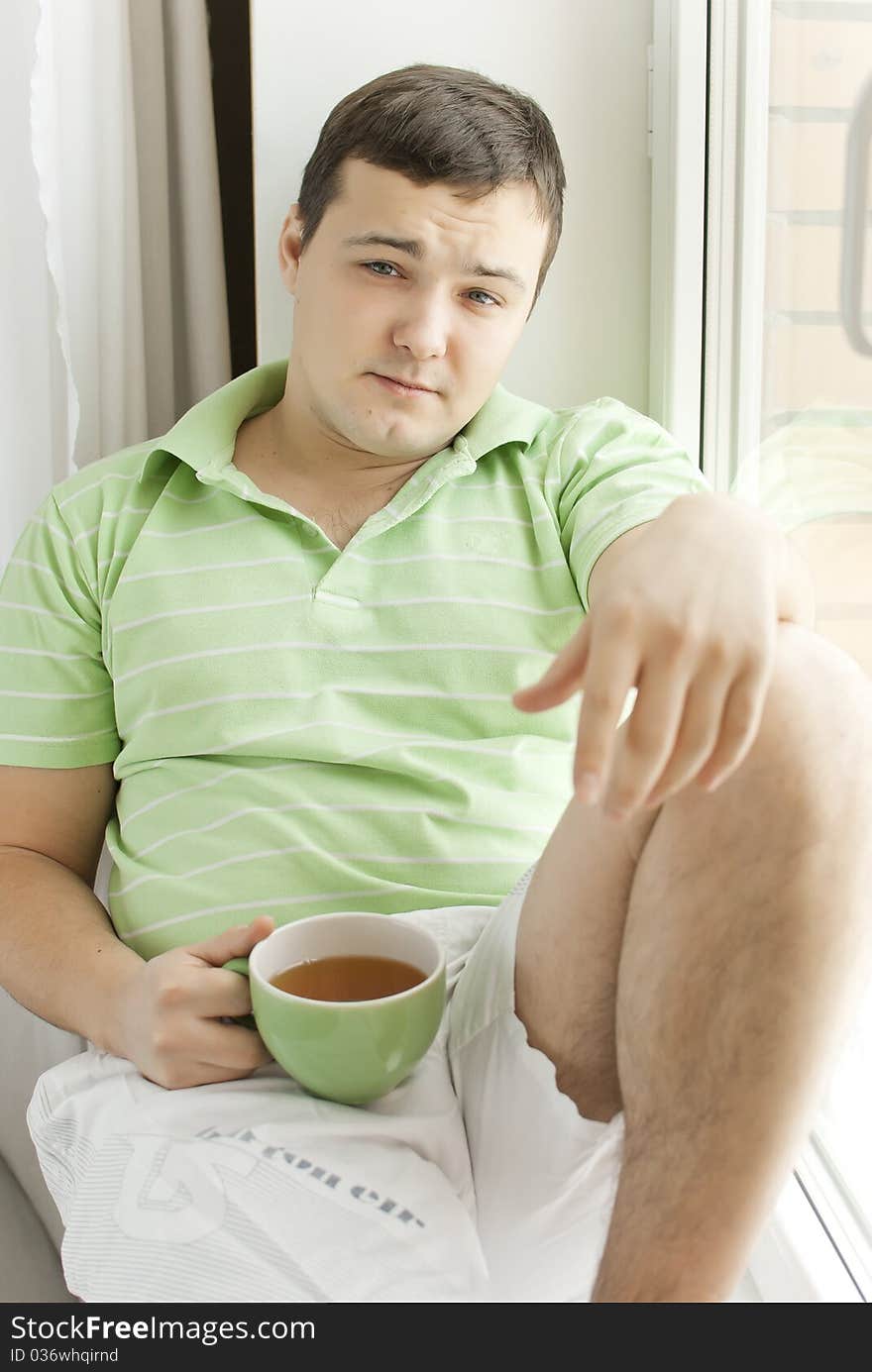 Young man drinking tea