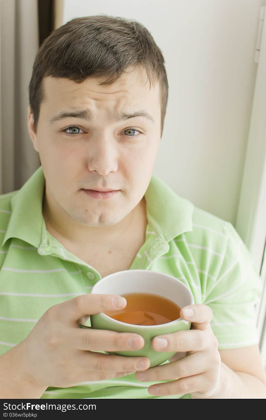 Young man drinking tea