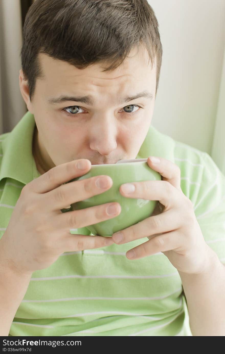 Young man drinking tea