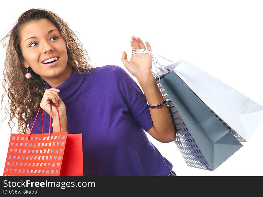 Cheerful young woman with shopping bags. Cheerful young woman with shopping bags