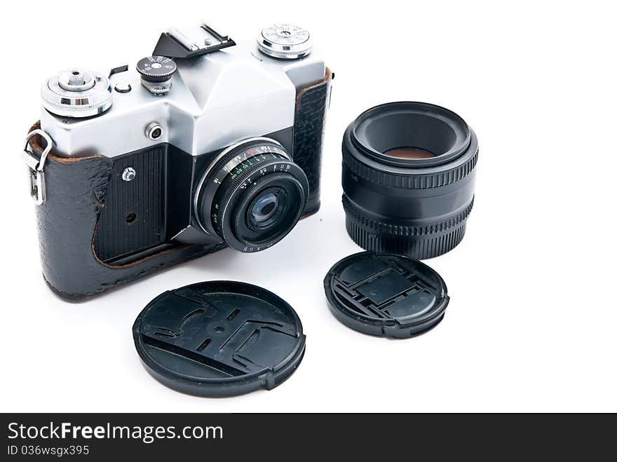 Retro-styled camera and lens isolated on white