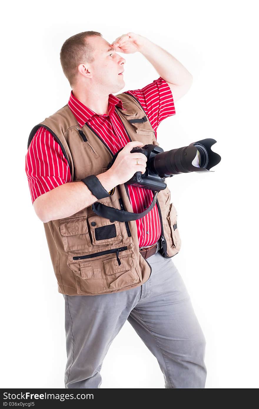 Photographer with digital kamera and zoom lens on white background