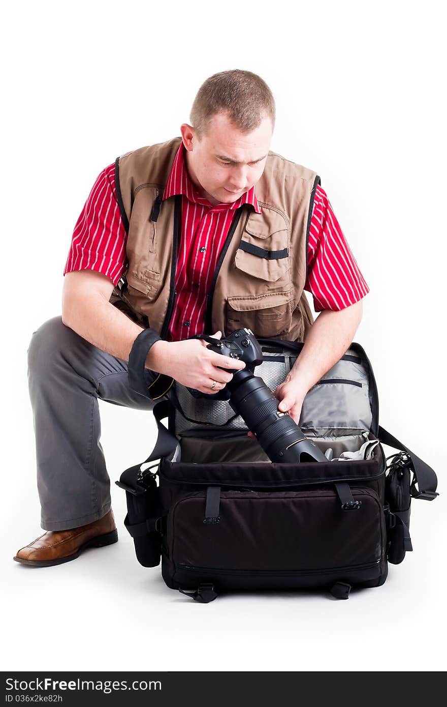 Photographer with digital kamera and zoom lens on white background