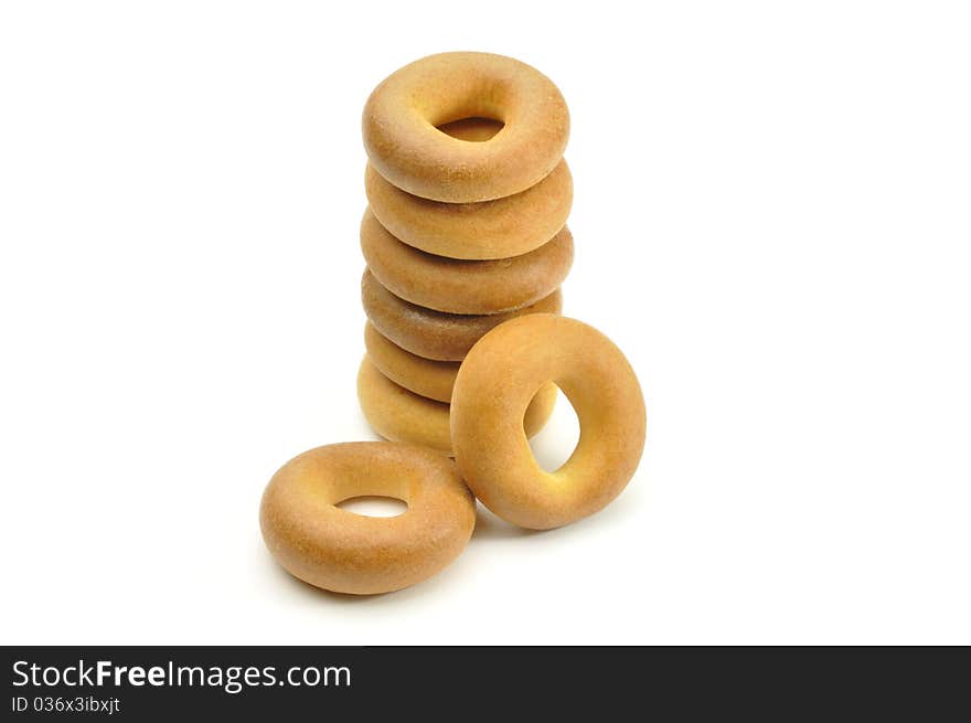 Heap of small bagels on white background