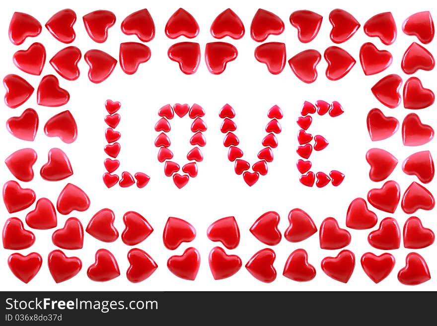 Word love in a framework from red hearts are isolated on a white background