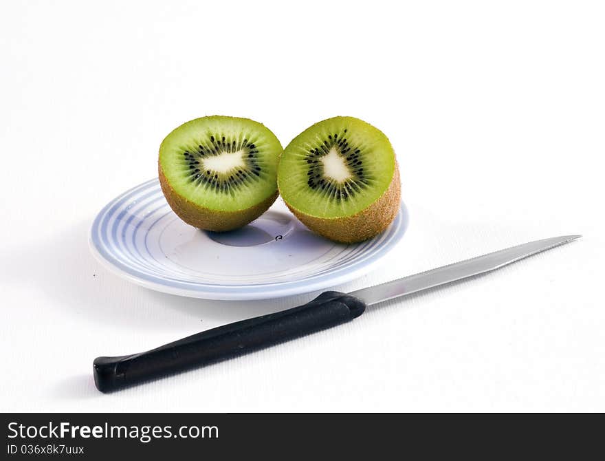 Kiwi on the plate with knife