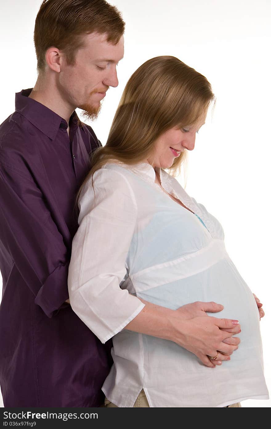 A young husband and wife awaiting the arrival of thier first child. A young husband and wife awaiting the arrival of thier first child.