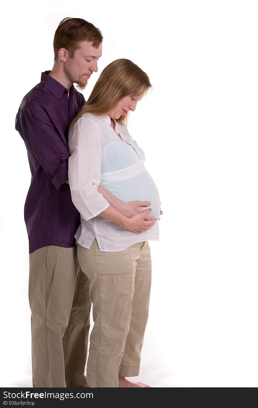 A young couple expecting the arrival of their first child. A young couple expecting the arrival of their first child.