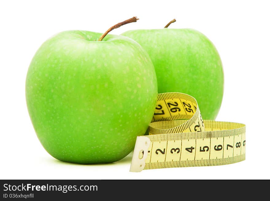 Green apple with centimeter isolated over white background. Green apple with centimeter isolated over white background