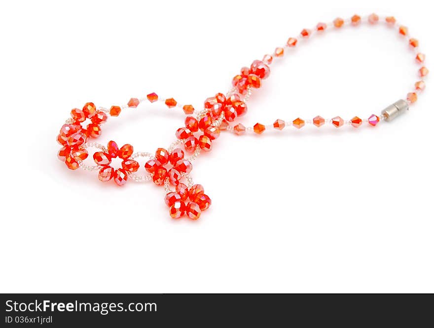 Beautiful red string of beads isolated on white background