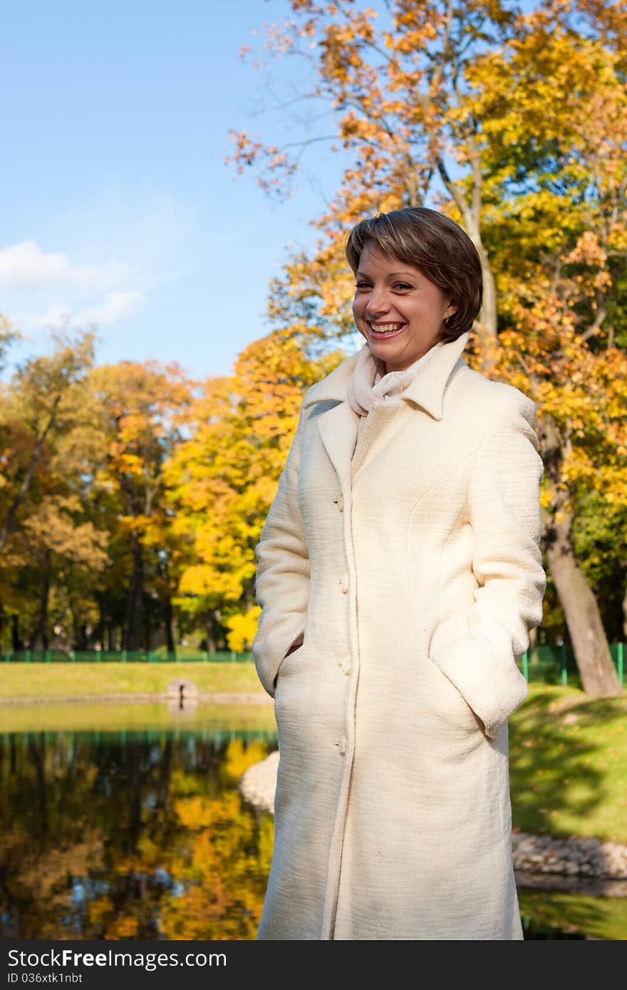 Charming Young Woman In An Autumn Park