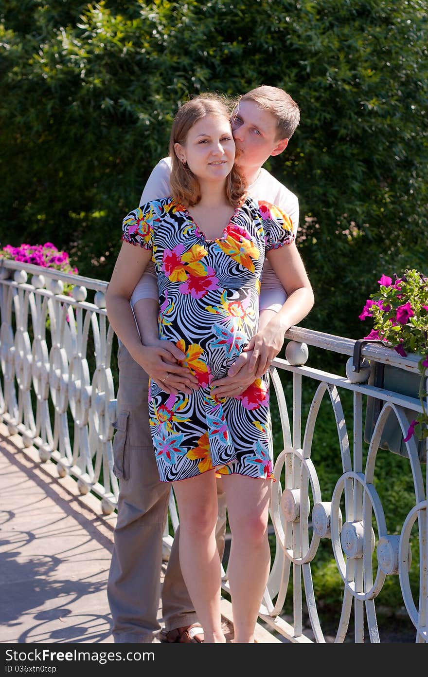 Young family in waiting for the child. A walk in the park