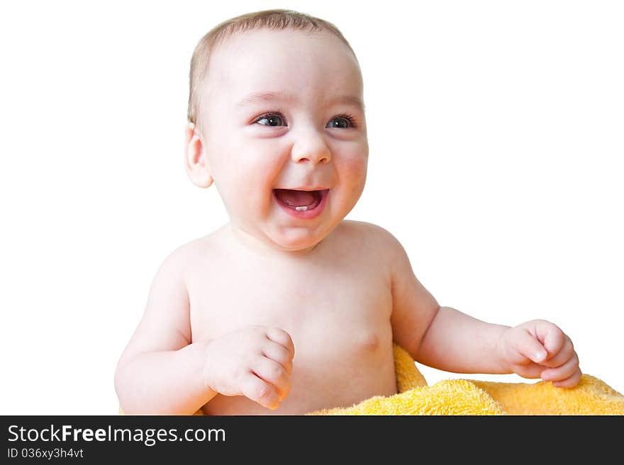 Caucasian baby boy after bath naked wrapped in yellow fluffy towel smiling. Caucasian baby boy after bath naked wrapped in yellow fluffy towel smiling