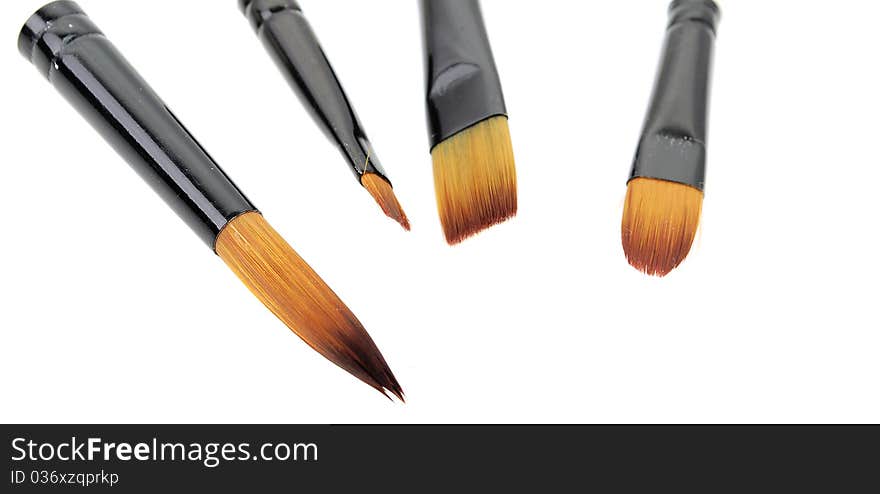 Painter tools with some brushes   isolated on the white background. Painter tools with some brushes   isolated on the white background.