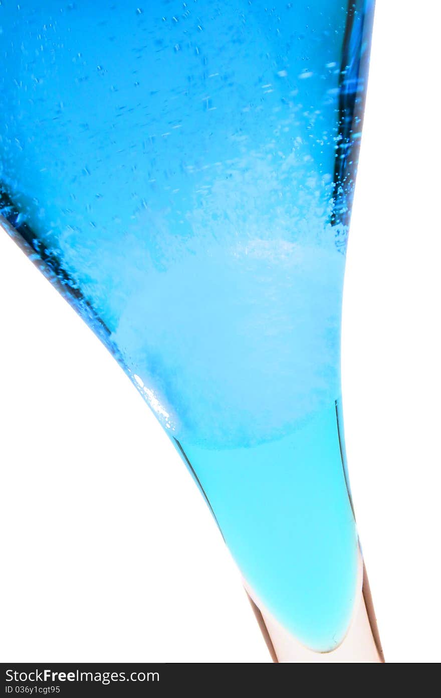 An effervescent tablet in a blue liquid. An effervescent tablet in a blue liquid.