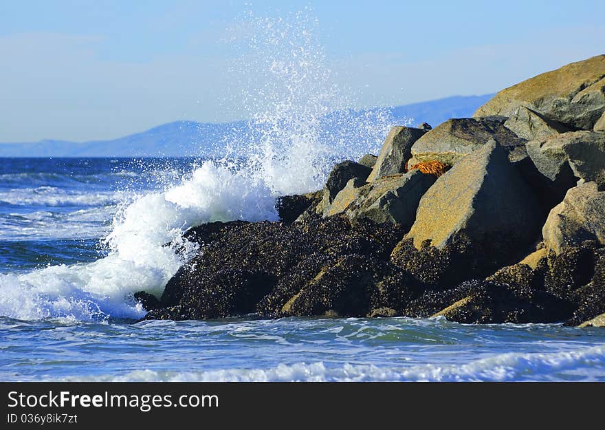 Ocean aves crushing into the rocks. Ocean aves crushing into the rocks